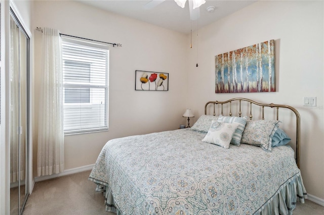 carpeted bedroom with ceiling fan