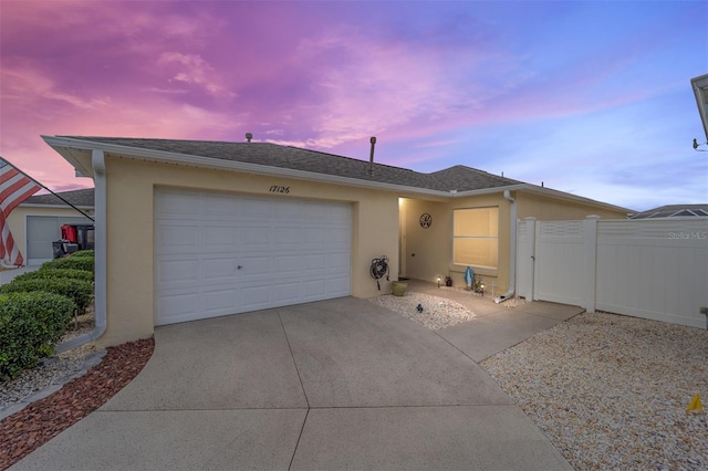 ranch-style home featuring a garage