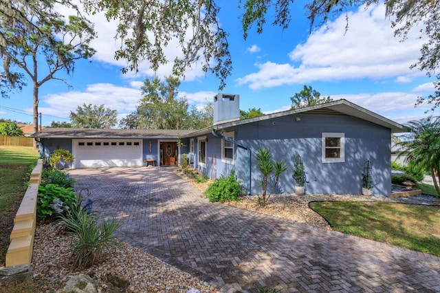 single story home featuring a garage