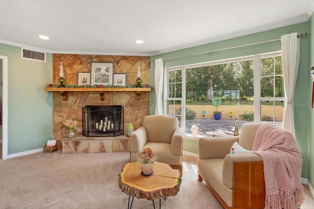 living room featuring carpet flooring, a fireplace, and crown molding