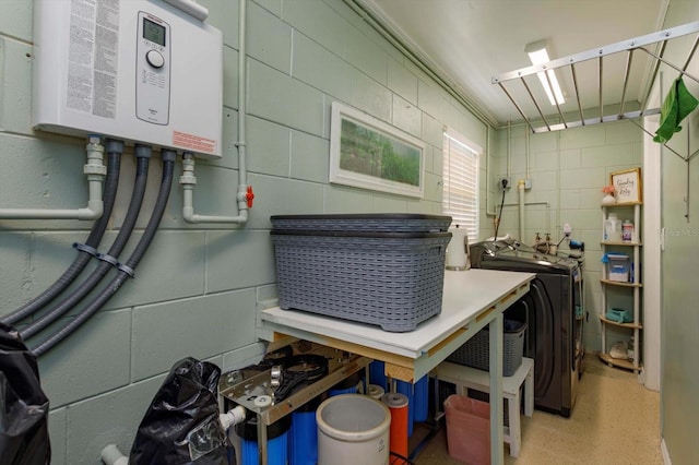 interior space with washer / clothes dryer and water heater