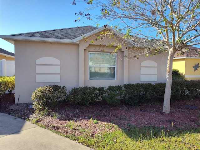 928 Nuthatch Ave, The Villages, FL 32163 - view of property exterior with stucco siding and a shingled roof