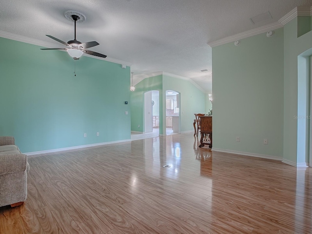 unfurnished living room with light hardwood / wood-style floors, ceiling fan, a textured ceiling, and ornamental molding