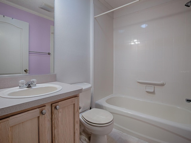 full bathroom with crown molding, vanity, a textured ceiling, tiled shower / bath combo, and toilet