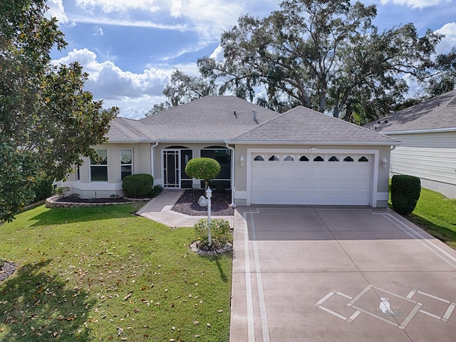 ranch-style home featuring a garage and a front lawn