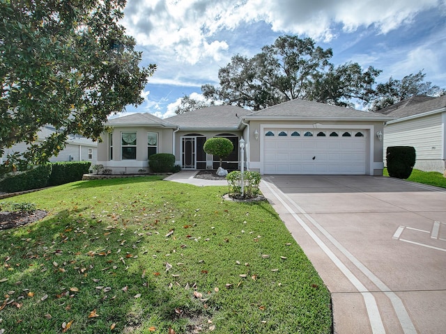 single story home with a garage and a front lawn