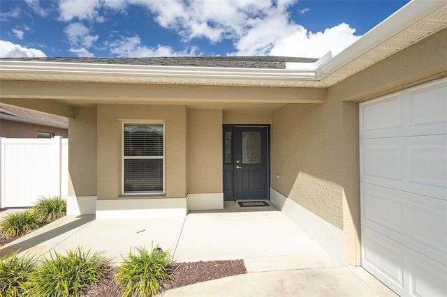 doorway to property featuring a garage