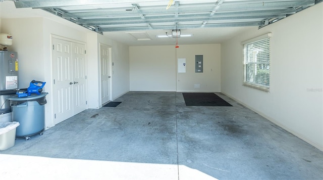 garage with a garage door opener and electric panel