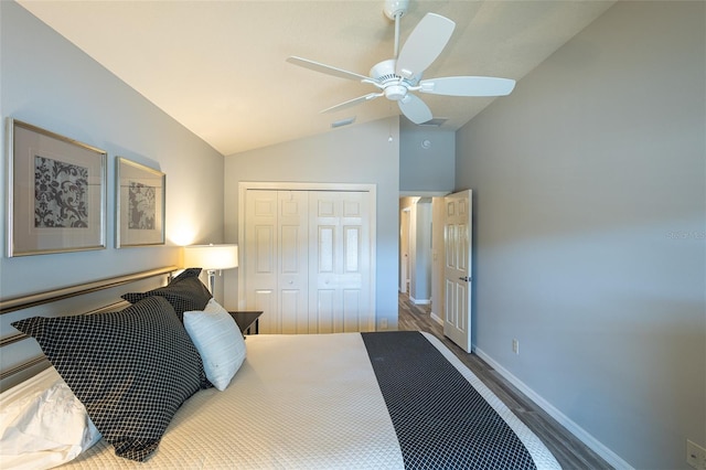 bedroom featuring baseboards, visible vents, ceiling fan, vaulted ceiling, and a closet