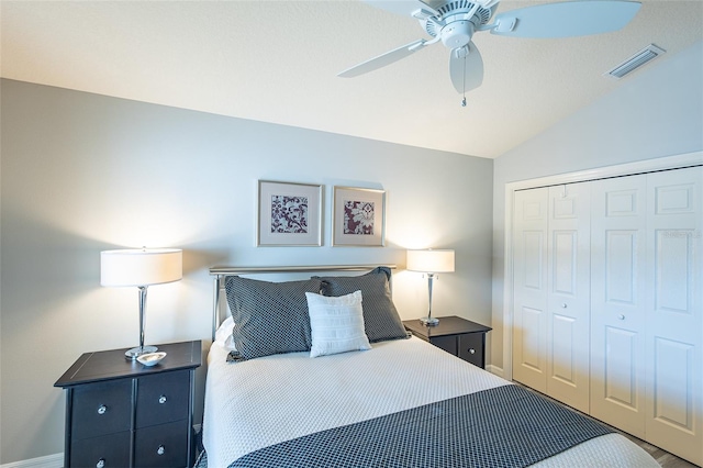 bedroom featuring a ceiling fan, visible vents, vaulted ceiling, and a closet