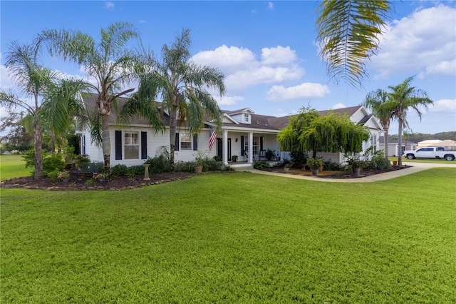 view of front facade featuring a front lawn and covered porch