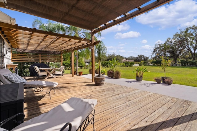 deck featuring a pergola and a yard