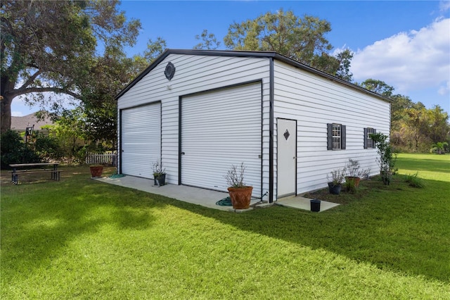 garage featuring a yard