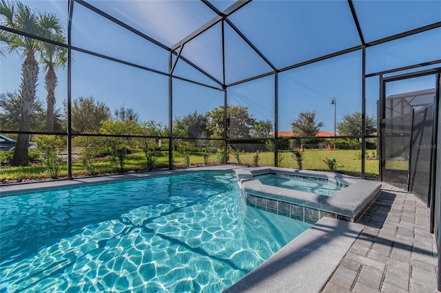 view of swimming pool featuring glass enclosure and an in ground hot tub