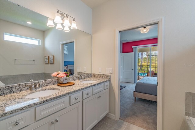 bathroom featuring vanity, plenty of natural light, and tile patterned floors