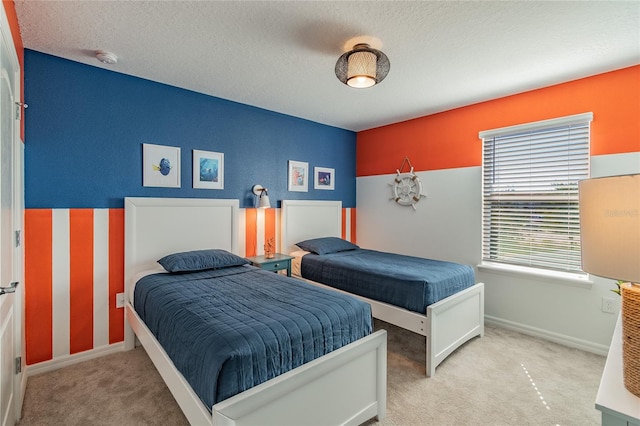 carpeted bedroom with a textured ceiling