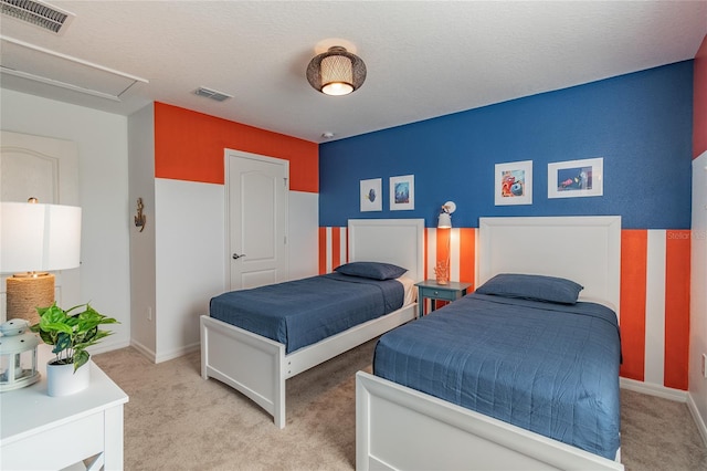 carpeted bedroom with a textured ceiling