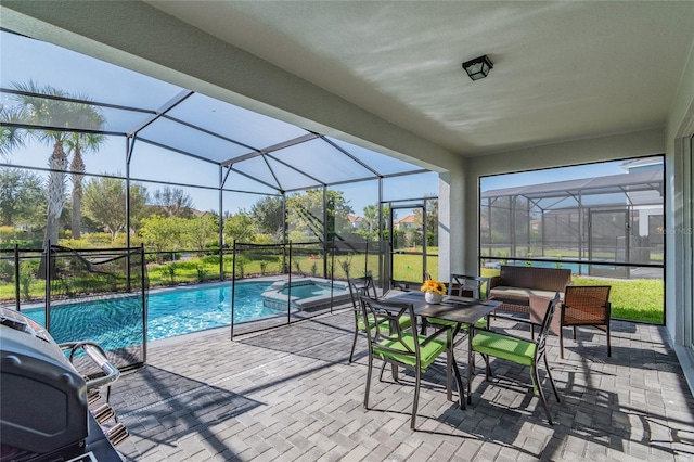 view of swimming pool with a lanai and a patio