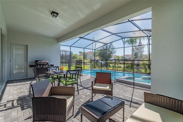 view of patio / terrace with glass enclosure and area for grilling