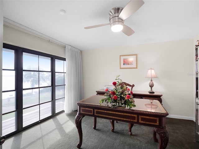 carpeted home office with ceiling fan