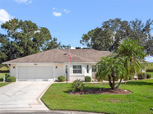 ranch-style home with a garage and a front yard