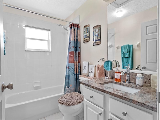 full bathroom featuring vanity, tile patterned floors, a textured ceiling, and toilet