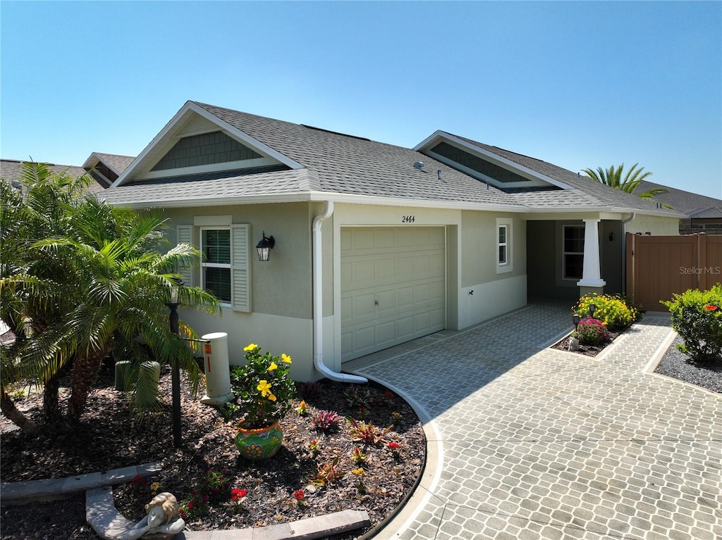 single story home featuring a garage