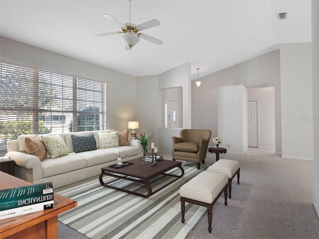 living room featuring ceiling fan, lofted ceiling, and light carpet