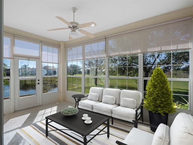 sunroom / solarium featuring ceiling fan