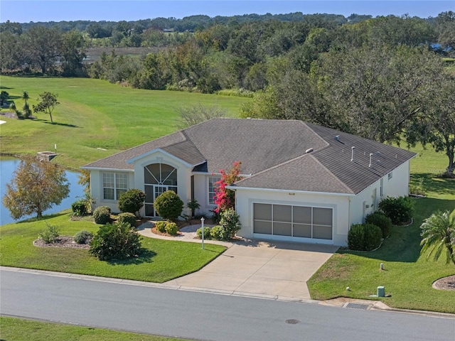 ranch-style house with a garage and a front yard