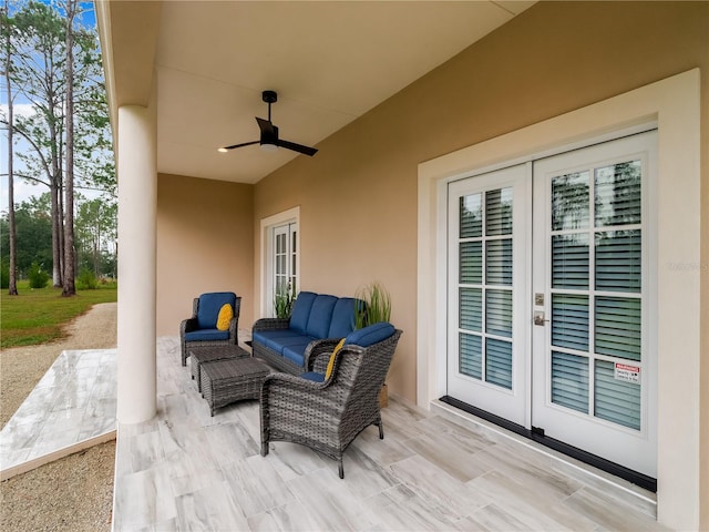 view of patio / terrace featuring french doors, an outdoor living space, and ceiling fan