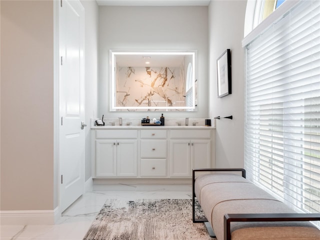 bathroom with plenty of natural light and vanity