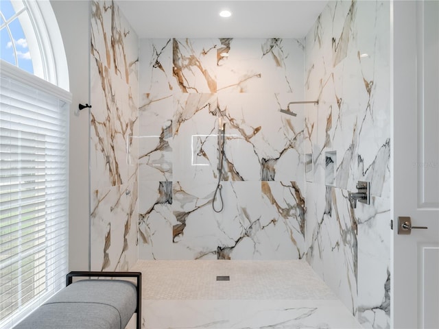 bathroom with a tile shower