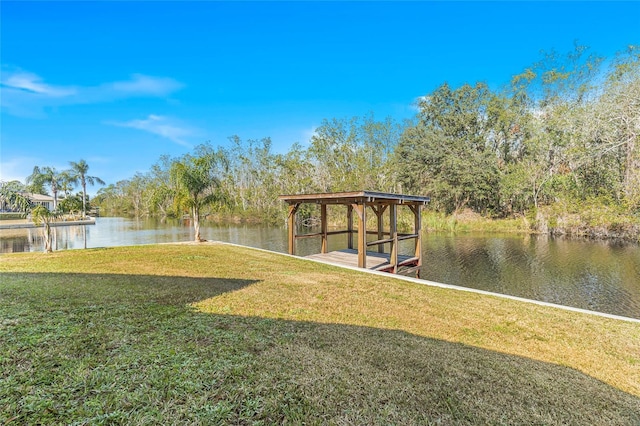 dock area featuring a yard and a water view