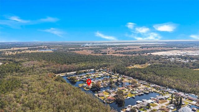 bird's eye view with a water view and a view of trees