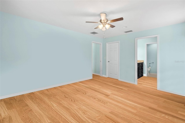 unfurnished bedroom with baseboards, visible vents, and light wood-style floors