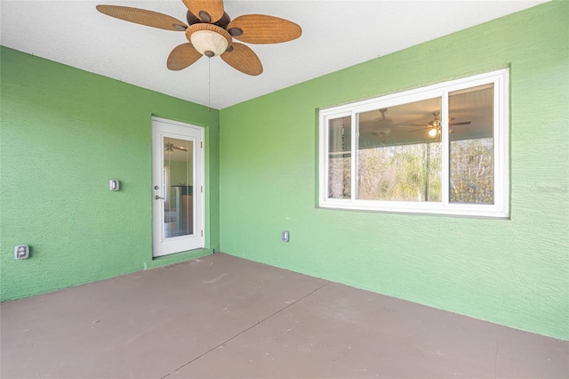 view of patio featuring ceiling fan