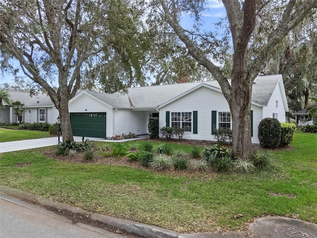 ranch-style home with a front lawn and a garage