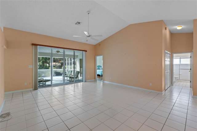 tiled spare room featuring high vaulted ceiling, ceiling fan, and a wealth of natural light