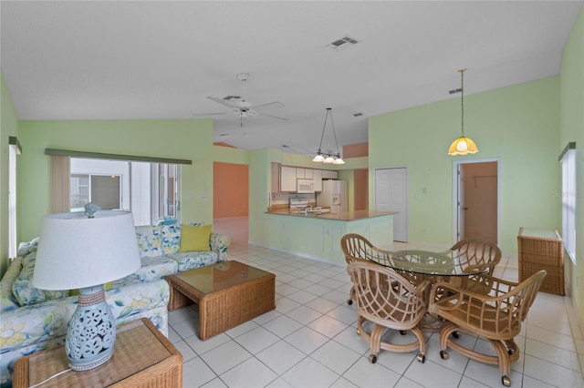 tiled living room with vaulted ceiling and ceiling fan