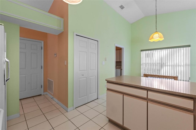 kitchen featuring pendant lighting, high vaulted ceiling, white cabinetry, and light tile patterned floors