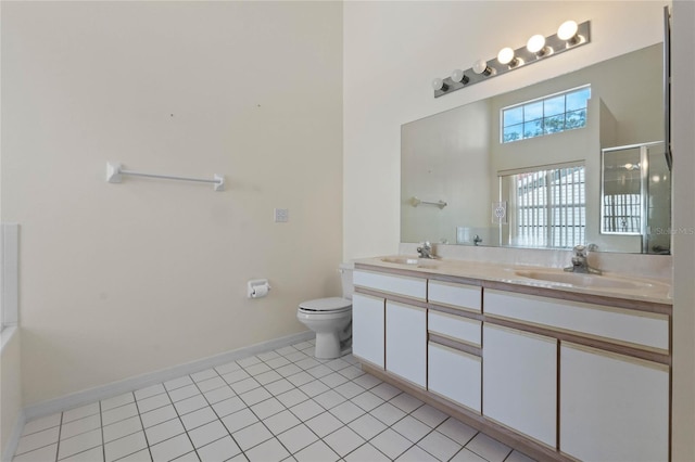 bathroom featuring tile patterned floors, vanity, an enclosed shower, and toilet