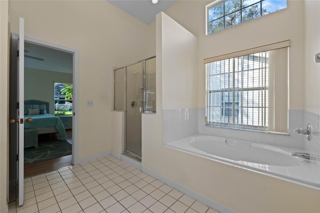 bathroom with tile patterned floors and separate shower and tub