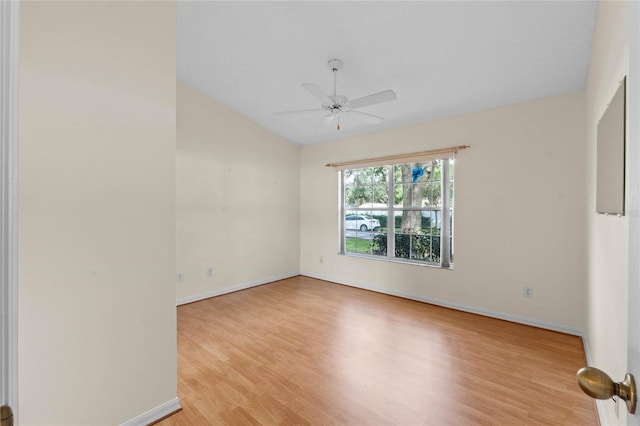 empty room with ceiling fan and light wood-type flooring