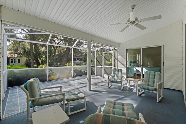 sunroom with ceiling fan and vaulted ceiling