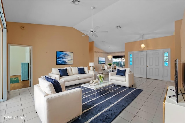 tiled living room featuring lofted ceiling and ceiling fan