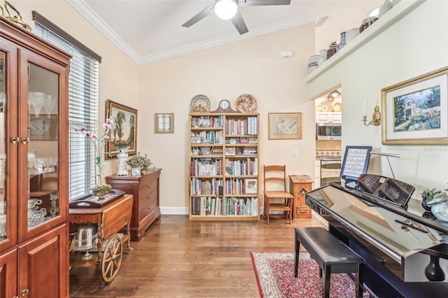 misc room with crown molding, ceiling fan, and dark hardwood / wood-style floors