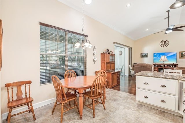 dining area featuring crown molding, vaulted ceiling, and ceiling fan