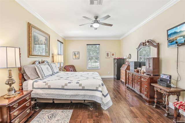 bedroom with dark hardwood / wood-style flooring, ornamental molding, and ceiling fan