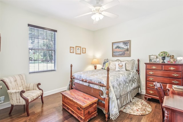 bedroom featuring dark hardwood / wood-style flooring and ceiling fan